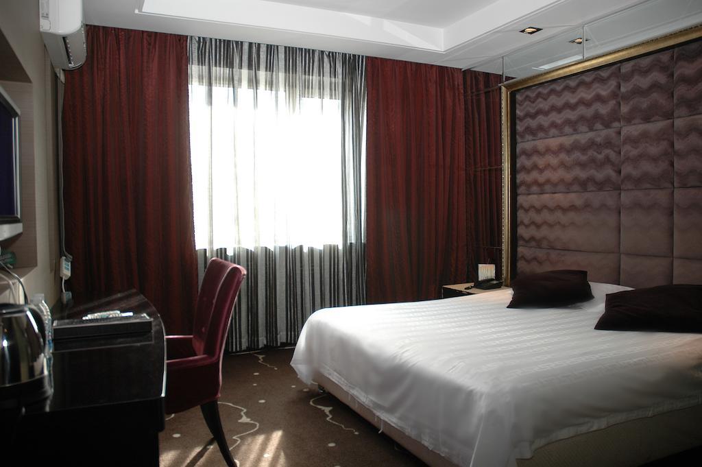 Harbin Yakelai Holiday Hotel Habitación foto