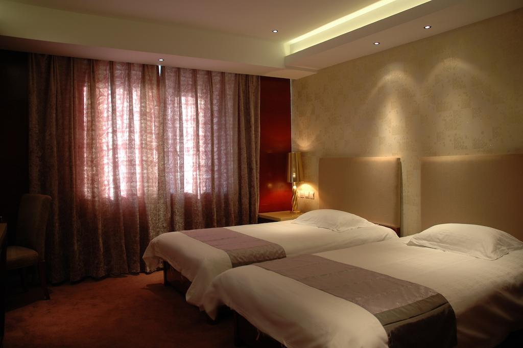 Harbin Yakelai Holiday Hotel Habitación foto