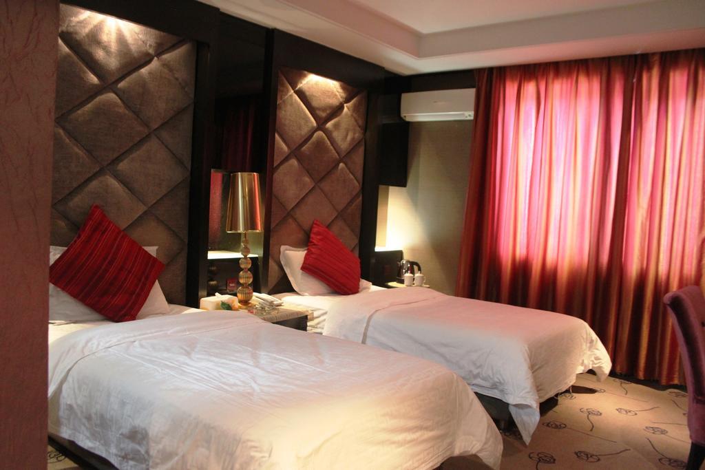 Harbin Yakelai Holiday Hotel Habitación foto